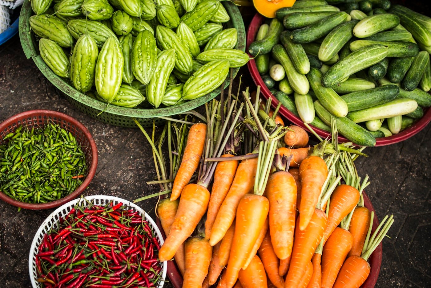 Fresh produce arranged in wooden harvest crates