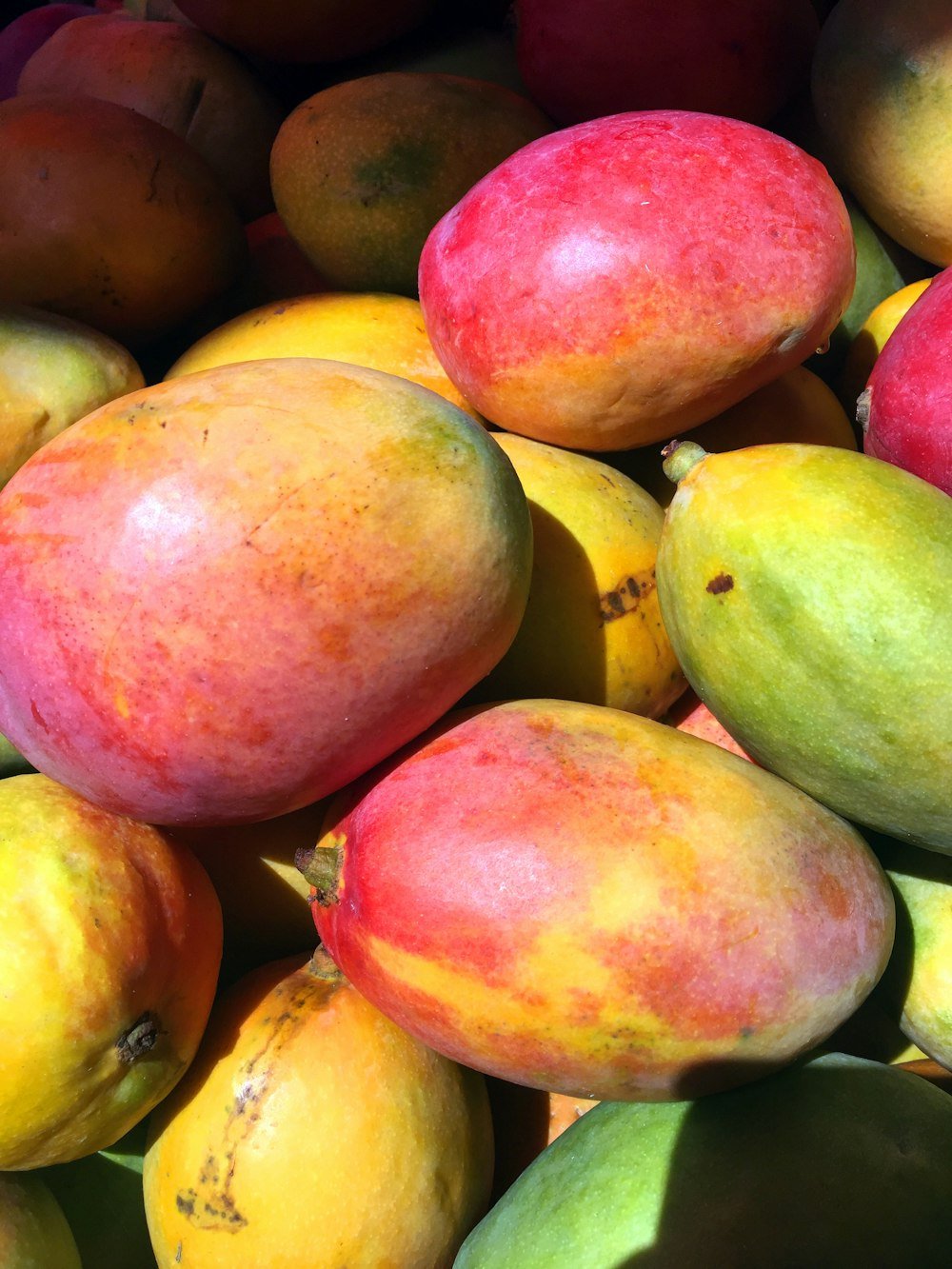 Cut and whole mangoes
